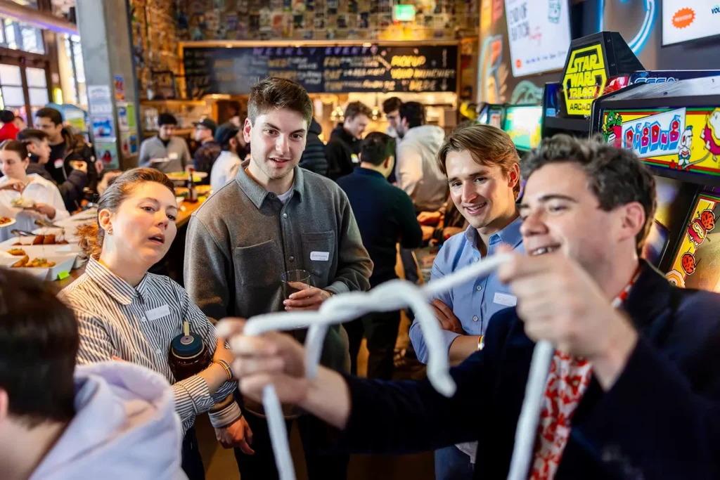 SF magician Chris Britt performing close-up magic for a small group at an intimate venue, The Detour in SF