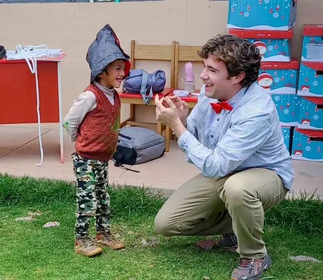 Chris Britt performing for an elementary school in Peru.
