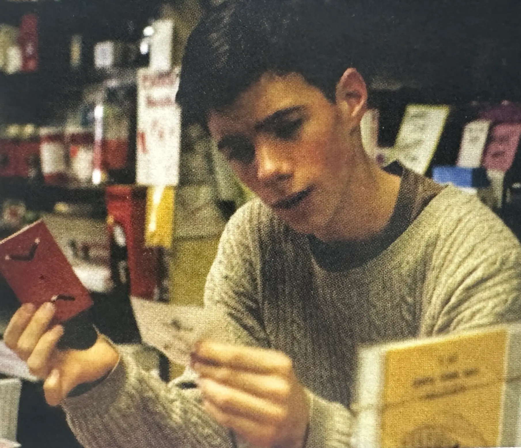 San Francisco magician Chris Britt working behind the counter of a magic shop